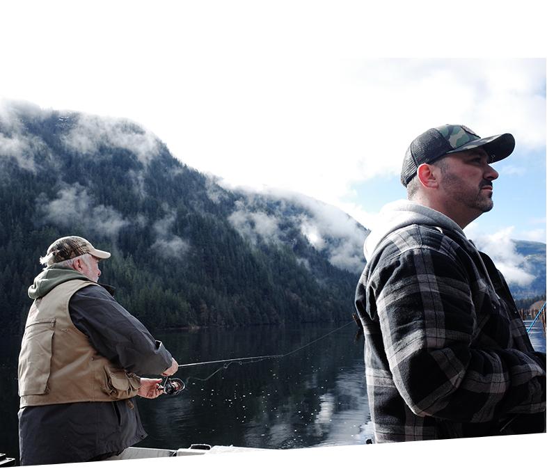 Two men on a fishing charter in the Powell River, British Columbia