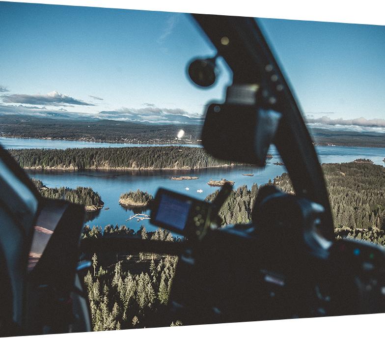 Helicopter view of the Lois Lake reservoir surrounded by forest