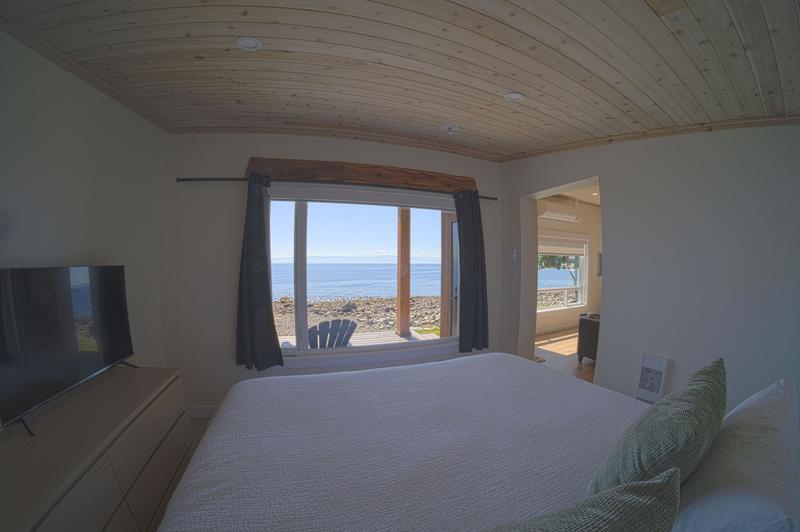 View of ocean through bedroom window