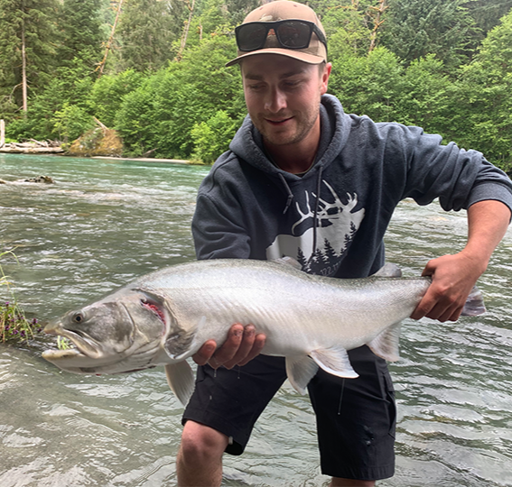 Owen Blackmore holding a fish he caught